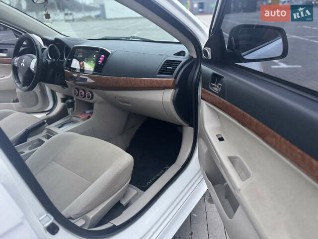 Белый Мицубиси Лансер, объемом двигателя 1.5 л и пробегом 314 тыс. км за 6500 $, фото 22 на Automoto.ua