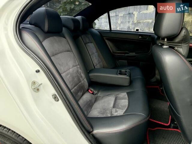 Білий Міцубісі Lancer, об'ємом двигуна 2 л та пробігом 170 тис. км за 6900 $, фото 11 на Automoto.ua
