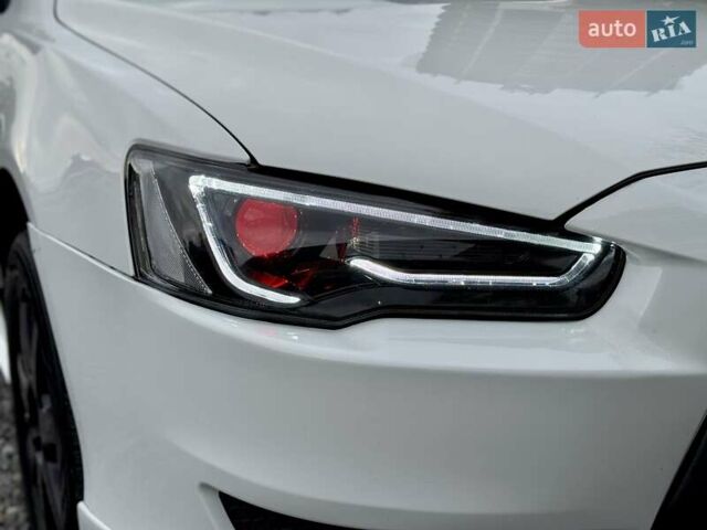 Білий Міцубісі Lancer, об'ємом двигуна 2 л та пробігом 170 тис. км за 6900 $, фото 4 на Automoto.ua