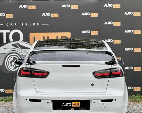 Білий Міцубісі Lancer, об'ємом двигуна 2 л та пробігом 170 тис. км за 6900 $, фото 6 на Automoto.ua