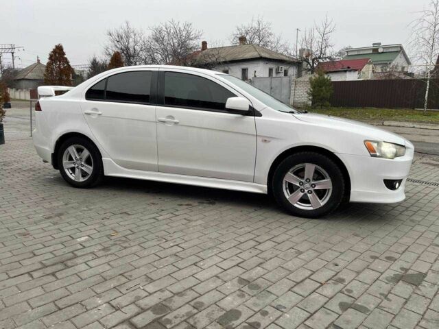 Білий Міцубісі Lancer, об'ємом двигуна 2 л та пробігом 190 тис. км за 7500 $, фото 4 на Automoto.ua