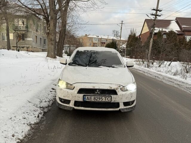 Белый Мицубиси Лансер, объемом двигателя 2 л и пробегом 207 тыс. км за 5750 $, фото 1 на Automoto.ua