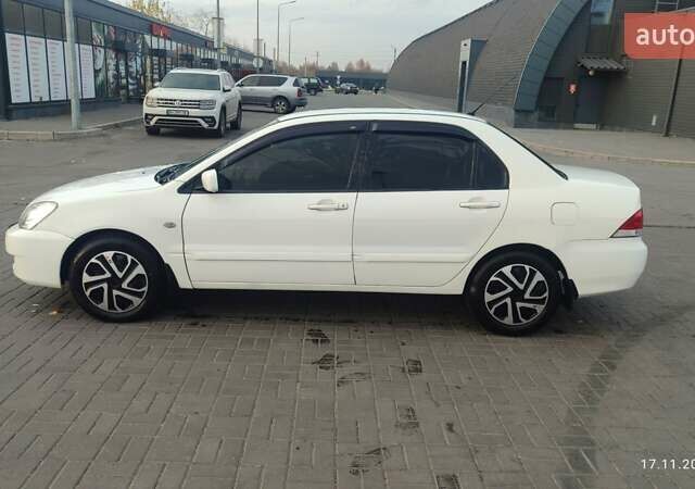 Білий Міцубісі Lancer, об'ємом двигуна 1.58 л та пробігом 250 тис. км за 4400 $, фото 8 на Automoto.ua