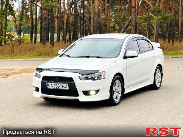 Белый Мицубиси Лансер, объемом двигателя 2 л и пробегом 185 тыс. км за 7999 $, фото 1 на Automoto.ua