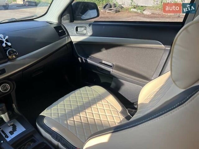 Белый Мицубиси Лансер, объемом двигателя 2 л и пробегом 277 тыс. км за 7000 $, фото 13 на Automoto.ua