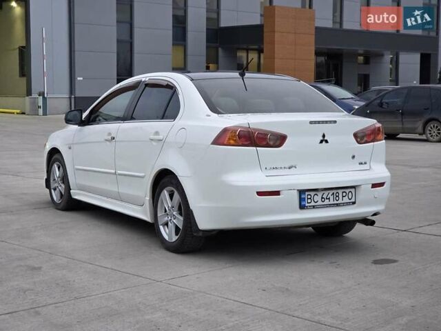 Белый Мицубиси Лансер, объемом двигателя 2 л и пробегом 218 тыс. км за 5555 $, фото 2 на Automoto.ua