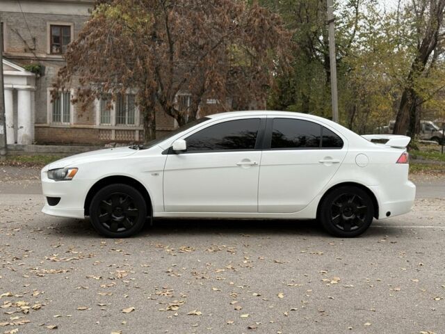 Белый Мицубиси Лансер, объемом двигателя 1.5 л и пробегом 265 тыс. км за 5600 $, фото 3 на Automoto.ua