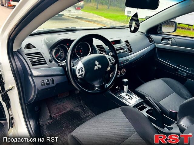 Белый Мицубиси Лансер, объемом двигателя 2 л и пробегом 185 тыс. км за 7999 $, фото 12 на Automoto.ua