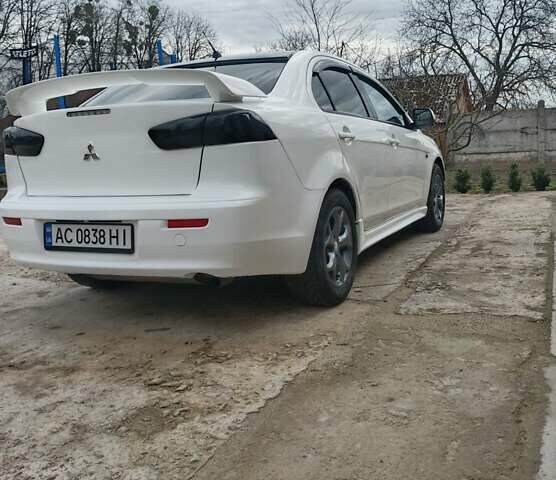 Білий Міцубісі Lancer, об'ємом двигуна 2 л та пробігом 287 тис. км за 6000 $, фото 5 на Automoto.ua