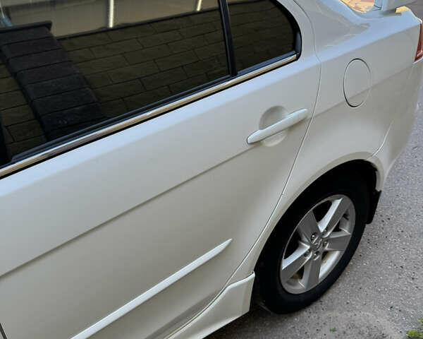 Белый Мицубиси Лансер, объемом двигателя 1.47 л и пробегом 230 тыс. км за 5800 $, фото 13 на Automoto.ua