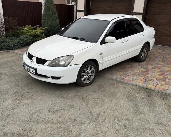 Белый Мицубиси Лансер, объемом двигателя 1.58 л и пробегом 285 тыс. км за 3500 $, фото 1 на Automoto.ua