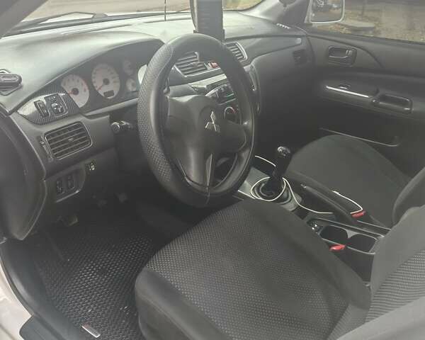 Белый Мицубиси Лансер, объемом двигателя 1.59 л и пробегом 222 тыс. км за 4950 $, фото 1 на Automoto.ua