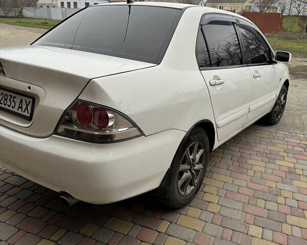 Белый Мицубиси Лансер, объемом двигателя 1.58 л и пробегом 285 тыс. км за 3500 $, фото 5 на Automoto.ua