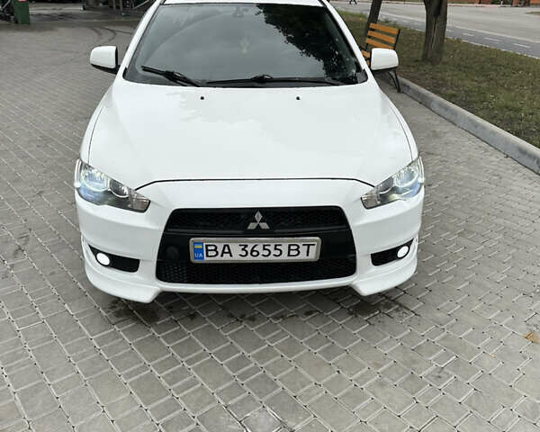 Белый Мицубиси Лансер, объемом двигателя 2 л и пробегом 258 тыс. км за 7100 $, фото 1 на Automoto.ua