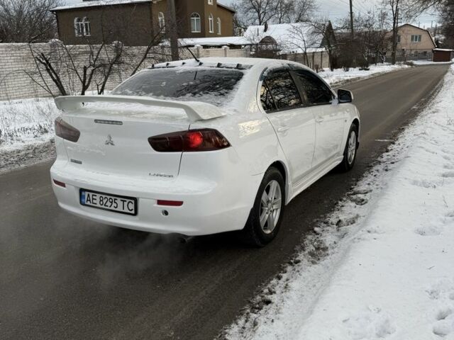 Белый Мицубиси Лансер, объемом двигателя 2 л и пробегом 207 тыс. км за 5750 $, фото 7 на Automoto.ua