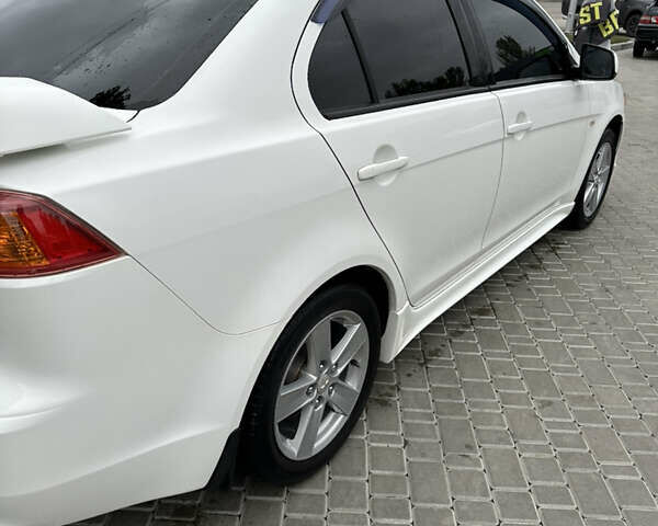 Белый Мицубиси Лансер, объемом двигателя 2 л и пробегом 258 тыс. км за 7100 $, фото 10 на Automoto.ua