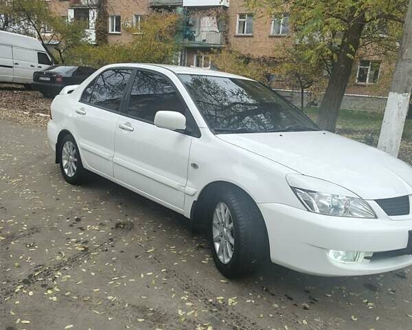 Белый Мицубиси Лансер, объемом двигателя 1.59 л и пробегом 222 тыс. км за 4950 $, фото 3 на Automoto.ua