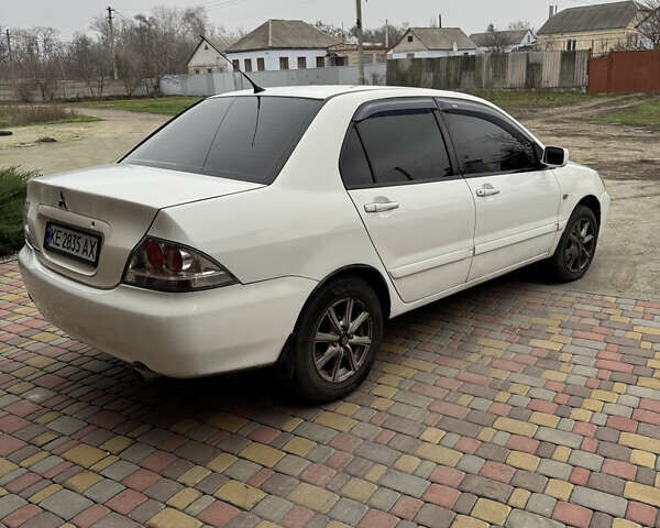 Белый Мицубиси Лансер, объемом двигателя 1.58 л и пробегом 285 тыс. км за 3500 $, фото 4 на Automoto.ua