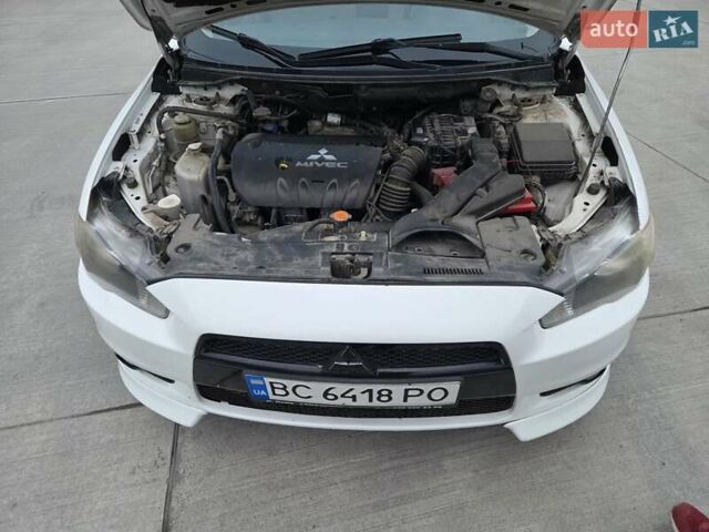 Белый Мицубиси Лансер, объемом двигателя 2 л и пробегом 218 тыс. км за 5555 $, фото 7 на Automoto.ua