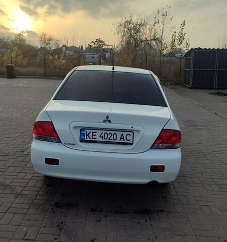 Білий Міцубісі Lancer, об'ємом двигуна 1.58 л та пробігом 250 тис. км за 4400 $, фото 6 на Automoto.ua