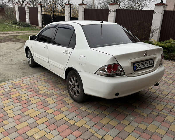 Белый Мицубиси Лансер, объемом двигателя 1.58 л и пробегом 285 тыс. км за 3500 $, фото 2 на Automoto.ua