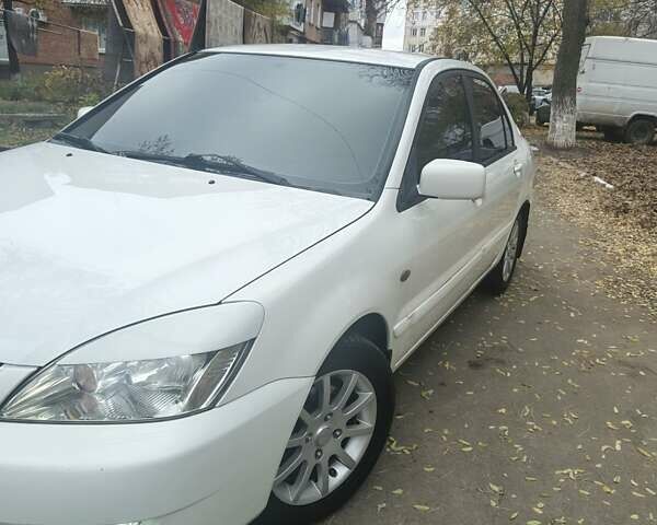 Белый Мицубиси Лансер, объемом двигателя 1.59 л и пробегом 222 тыс. км за 4950 $, фото 4 на Automoto.ua