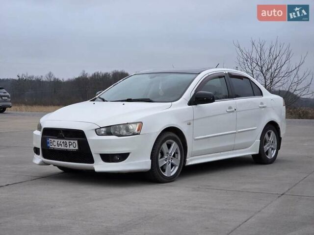 Белый Мицубиси Лансер, объемом двигателя 2 л и пробегом 218 тыс. км за 5555 $, фото 8 на Automoto.ua