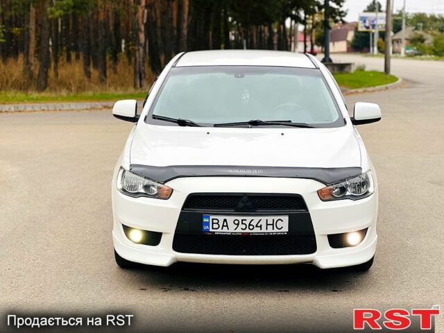 Белый Мицубиси Лансер, объемом двигателя 2 л и пробегом 185 тыс. км за 7999 $, фото 7 на Automoto.ua