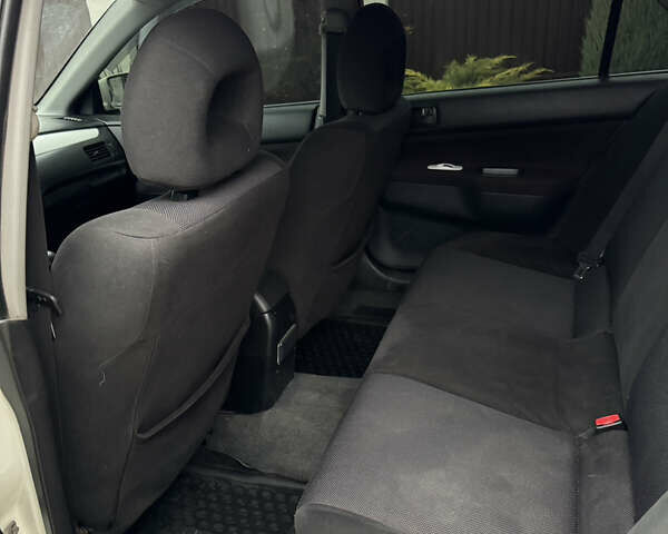 Белый Мицубиси Лансер, объемом двигателя 1.58 л и пробегом 285 тыс. км за 3500 $, фото 11 на Automoto.ua