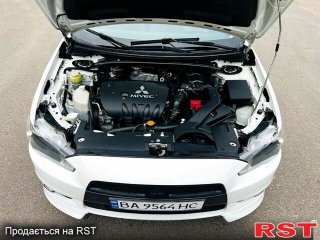 Белый Мицубиси Лансер, объемом двигателя 2 л и пробегом 185 тыс. км за 7999 $, фото 13 на Automoto.ua