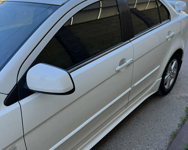 Белый Мицубиси Лансер, объемом двигателя 1.47 л и пробегом 230 тыс. км за 5800 $, фото 12 на Automoto.ua