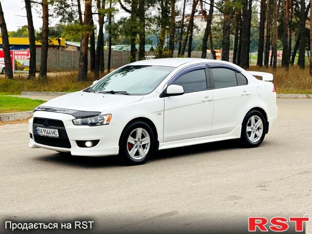 Белый Мицубиси Лансер, объемом двигателя 2 л и пробегом 185 тыс. км за 7999 $, фото 2 на Automoto.ua