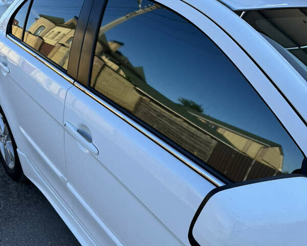 Белый Мицубиси Лансер, объемом двигателя 1.47 л и пробегом 230 тыс. км за 5800 $, фото 11 на Automoto.ua