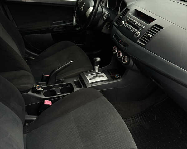 Белый Мицубиси Лансер, объемом двигателя 1.47 л и пробегом 230 тыс. км за 5800 $, фото 18 на Automoto.ua