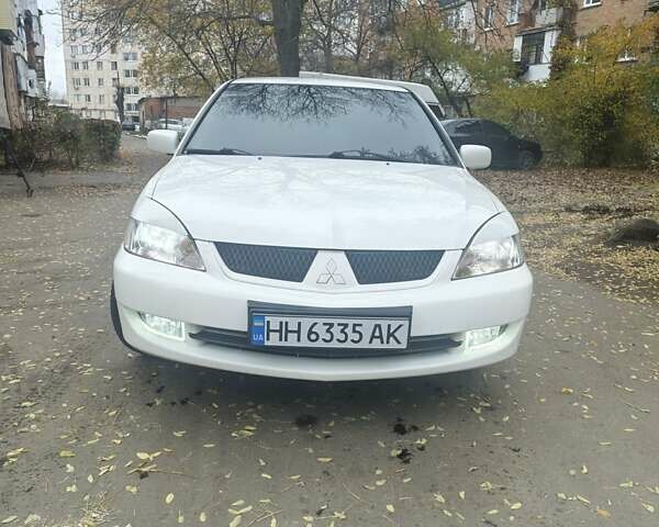 Белый Мицубиси Лансер, объемом двигателя 1.59 л и пробегом 222 тыс. км за 4950 $, фото 5 на Automoto.ua