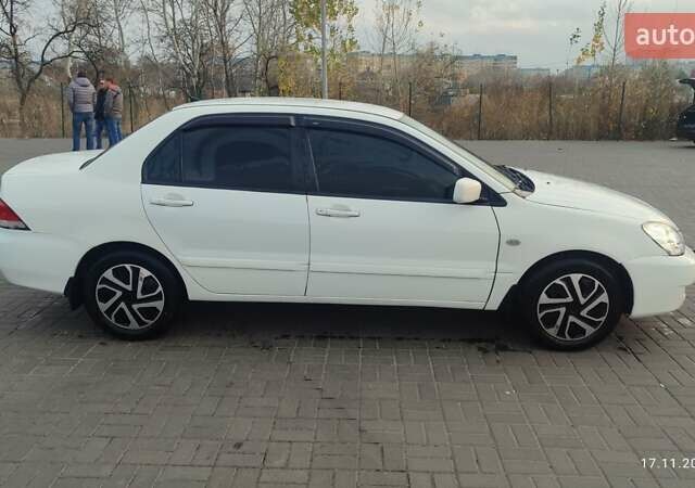 Білий Міцубісі Lancer, об'ємом двигуна 1.58 л та пробігом 250 тис. км за 4400 $, фото 7 на Automoto.ua