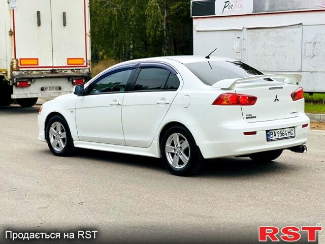 Белый Мицубиси Лансер, объемом двигателя 2 л и пробегом 185 тыс. км за 7999 $, фото 3 на Automoto.ua