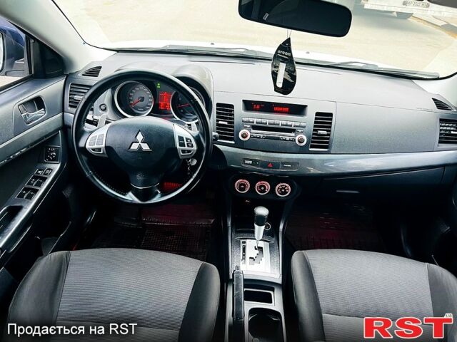 Белый Мицубиси Лансер, объемом двигателя 2 л и пробегом 185 тыс. км за 7999 $, фото 10 на Automoto.ua