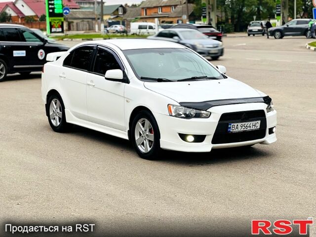 Белый Мицубиси Лансер, объемом двигателя 2 л и пробегом 185 тыс. км за 7999 $, фото 6 на Automoto.ua