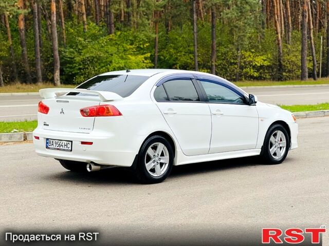 Белый Мицубиси Лансер, объемом двигателя 2 л и пробегом 185 тыс. км за 7999 $, фото 5 на Automoto.ua