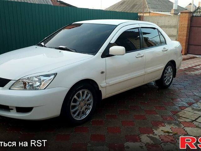 Білий Міцубісі Lancer, об'ємом двигуна 1.6 л та пробігом 237 тис. км за 6000 $, фото 13 на Automoto.ua