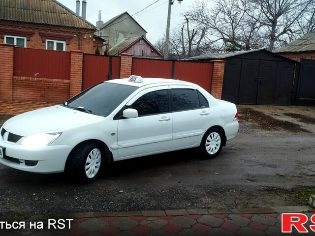Білий Міцубісі Lancer, об'ємом двигуна 1.6 л та пробігом 237 тис. км за 6000 $, фото 12 на Automoto.ua