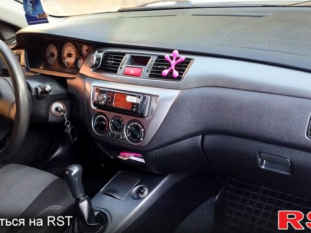 Білий Міцубісі Lancer, об'ємом двигуна 1.6 л та пробігом 237 тис. км за 6000 $, фото 5 на Automoto.ua