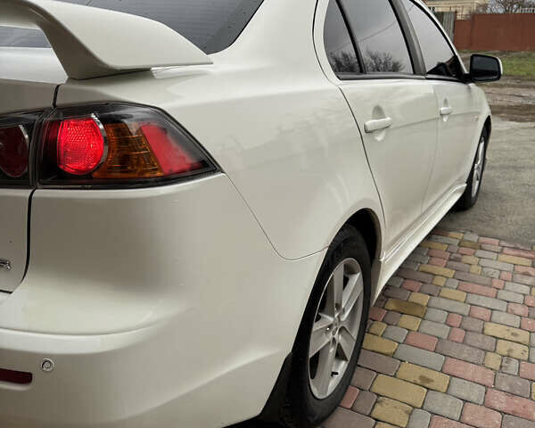 Білий Міцубісі Lancer, об'ємом двигуна 2 л та пробігом 269 тис. км за 6000 $, фото 7 на Automoto.ua