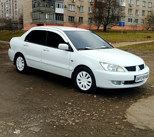 Білий Міцубісі Lancer, об'ємом двигуна 1.6 л та пробігом 237 тис. км за 6000 $, фото 10 на Automoto.ua