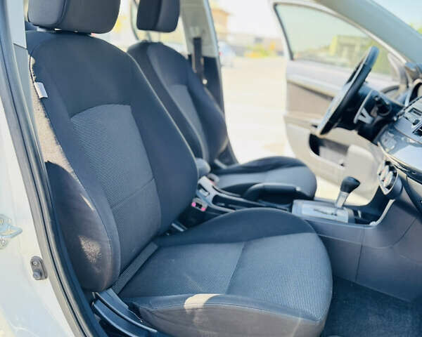 Білий Міцубісі Lancer, об'ємом двигуна 2 л та пробігом 163 тис. км за 6500 $, фото 20 на Automoto.ua