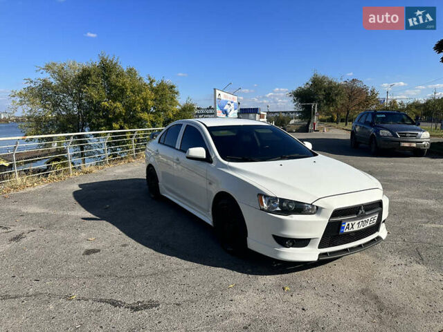 Білий Міцубісі Lancer, об'ємом двигуна 2 л та пробігом 198 тис. км за 10000 $, фото 3 на Automoto.ua