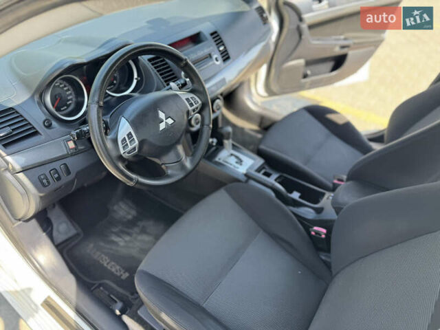Білий Міцубісі Lancer, об'ємом двигуна 2 л та пробігом 163 тис. км за 6500 $, фото 27 на Automoto.ua