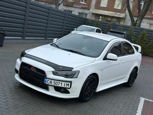 Белый Мицубиси Лансер, объемом двигателя 2 л и пробегом 225 тыс. км за 7800 $, фото 1 на Automoto.ua