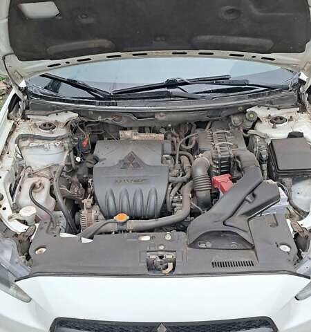 Белый Мицубиси Лансер, объемом двигателя 1.5 л и пробегом 160 тыс. км за 7600 $, фото 16 на Automoto.ua